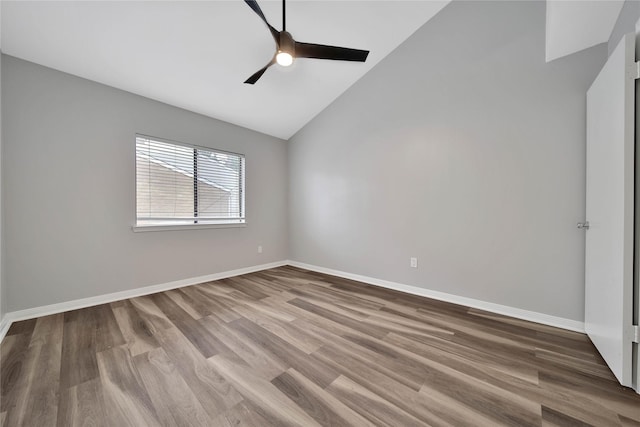 spare room with vaulted ceiling, ceiling fan, and hardwood / wood-style floors