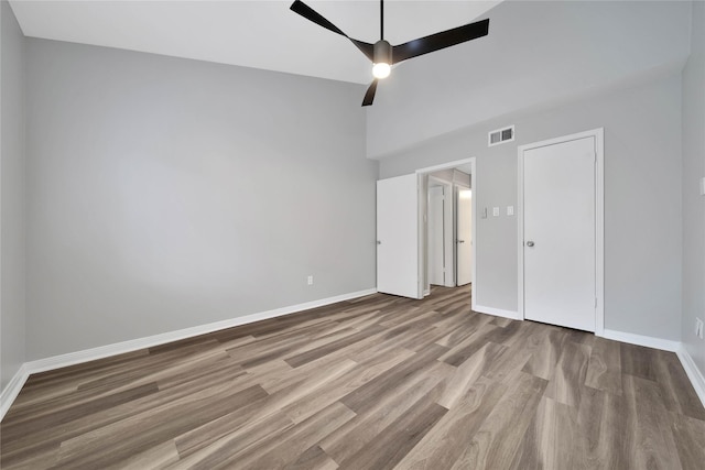 unfurnished bedroom with ceiling fan and light hardwood / wood-style floors