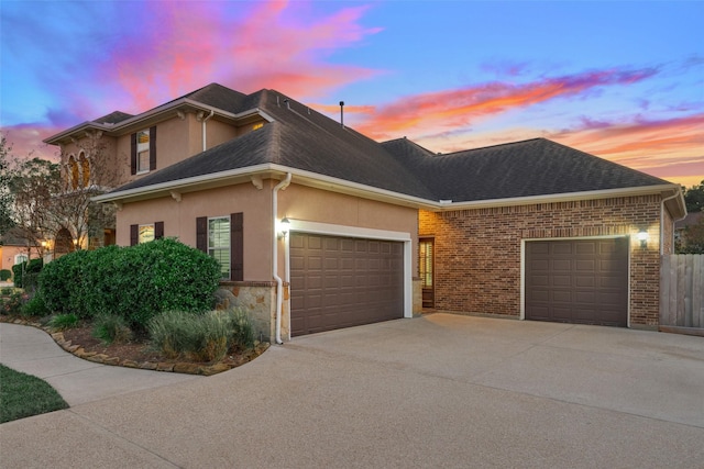 property exterior at dusk with a garage