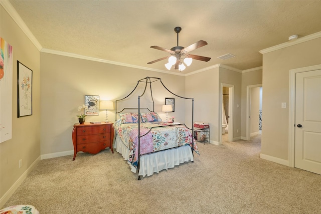 carpeted bedroom featuring ceiling fan, ornamental molding, a textured ceiling, and ensuite bathroom