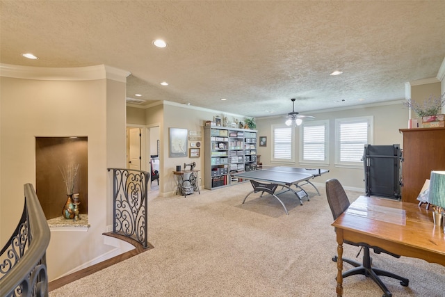 playroom featuring ornamental molding, a textured ceiling, and carpet flooring