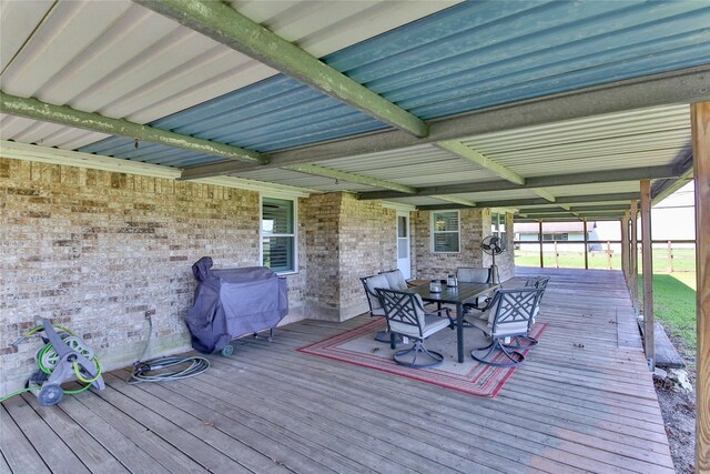 wooden terrace featuring grilling area