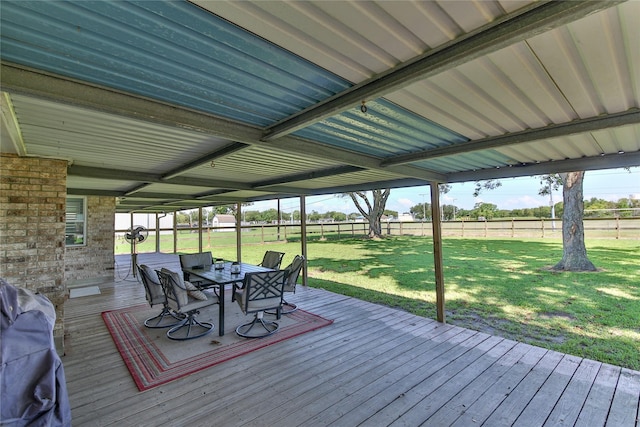 wooden terrace with a yard