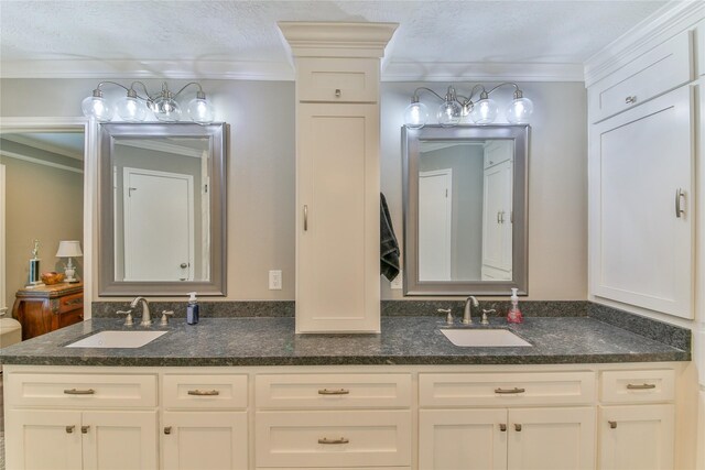 bathroom featuring vanity and crown molding