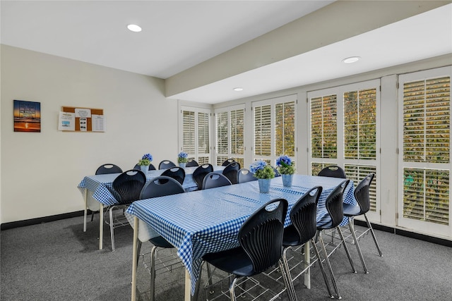 dining space featuring carpet floors and a healthy amount of sunlight