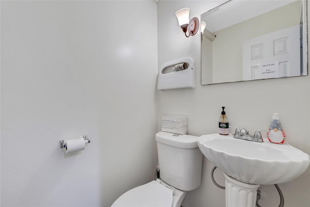 bathroom featuring sink and toilet