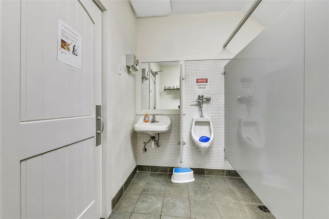 bathroom with sink, tile patterned floors, and toilet