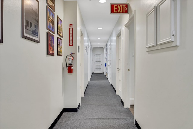 corridor with carpet flooring