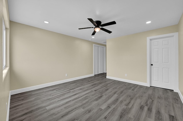 unfurnished bedroom featuring hardwood / wood-style floors and ceiling fan