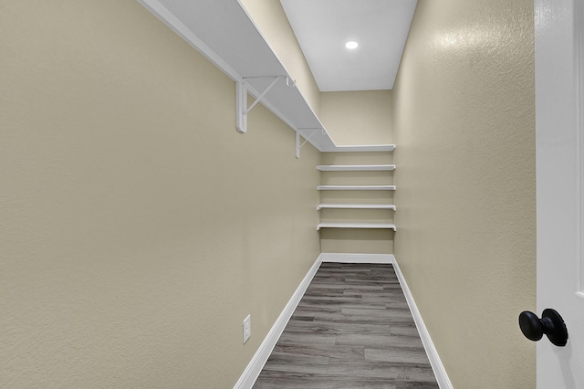 spacious closet featuring hardwood / wood-style floors