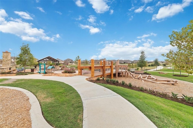 view of community with a lawn and a playground