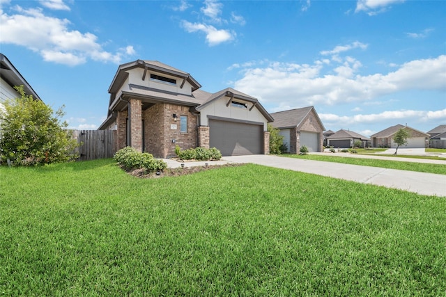 view of front of home featuring a garage and a front yard