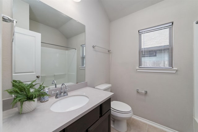 bathroom featuring a shower, vaulted ceiling, tile patterned floors, toilet, and vanity