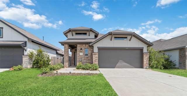 view of front facade featuring a garage and a front yard