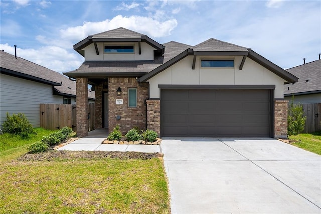 view of front facade with a garage and a front yard