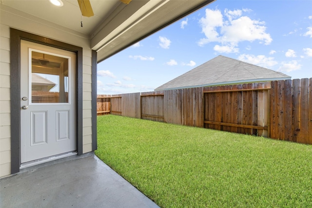 view of yard featuring ceiling fan