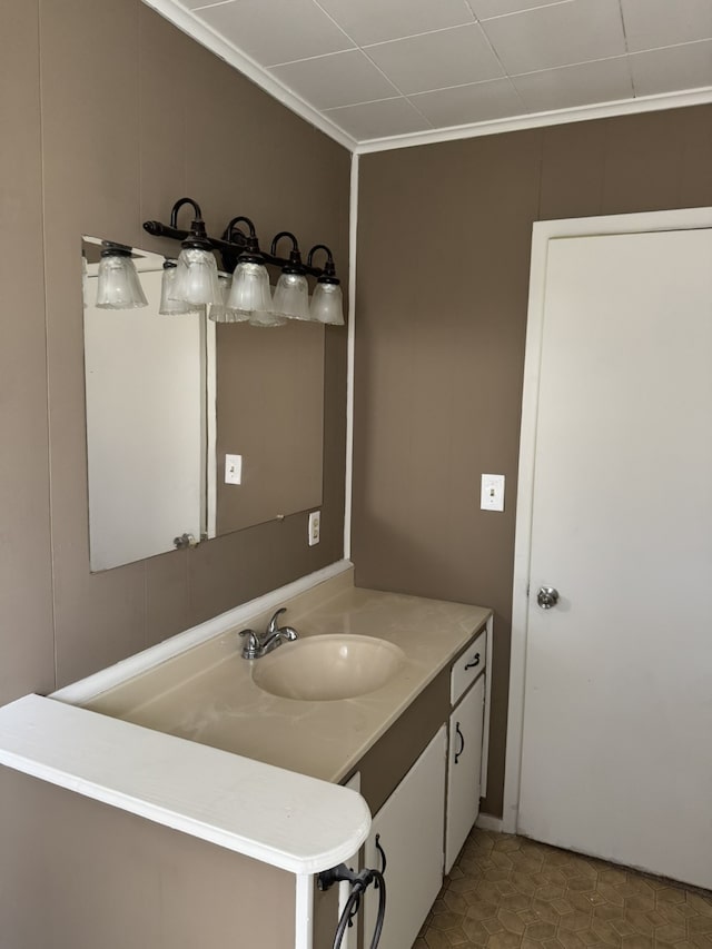 bathroom with vanity, tile patterned floors, and ornamental molding