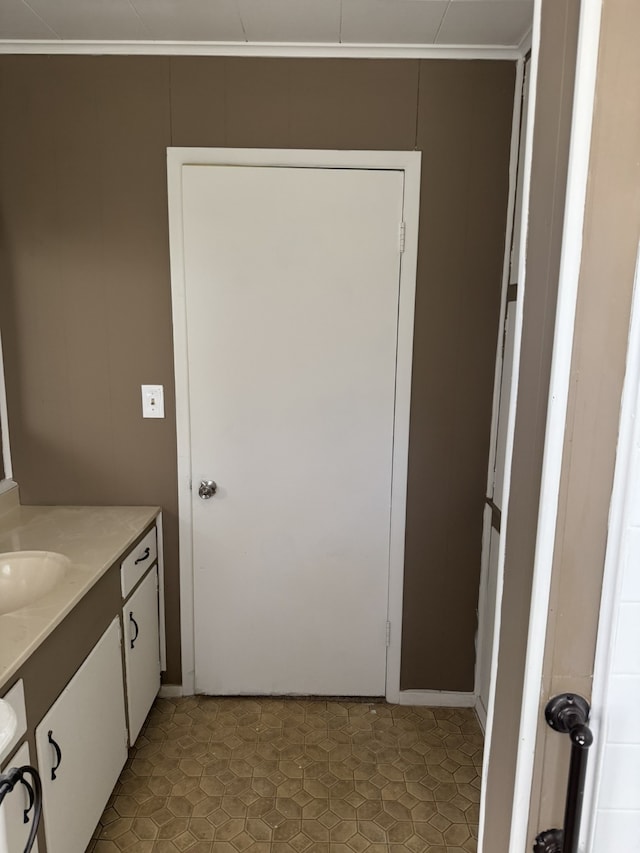 bathroom featuring vanity and crown molding