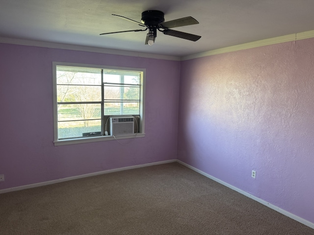 carpeted empty room featuring cooling unit, ceiling fan, and ornamental molding