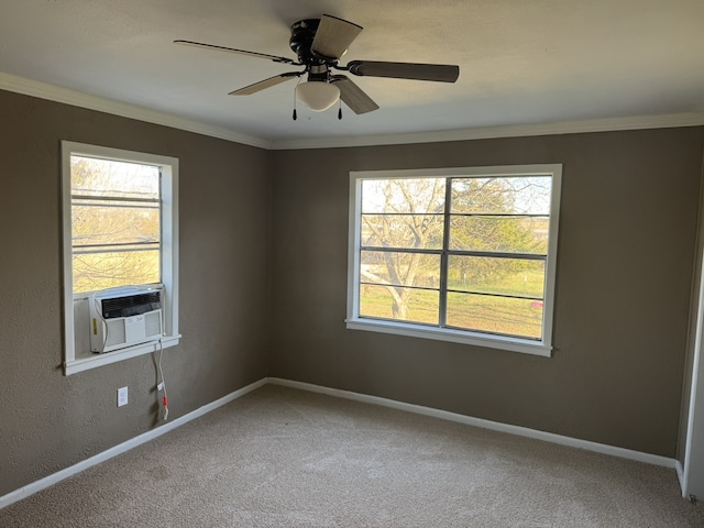 empty room with carpet floors, cooling unit, ceiling fan, and ornamental molding