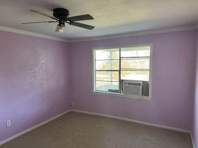 carpeted spare room featuring crown molding, cooling unit, and ceiling fan