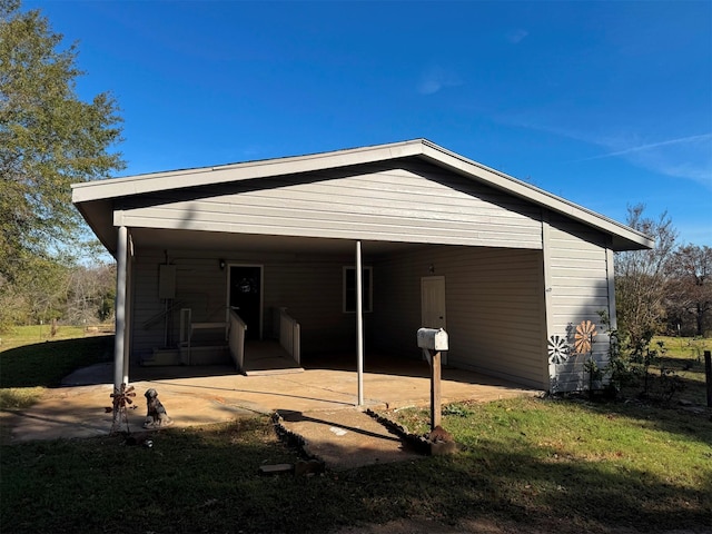 back of house with a carport