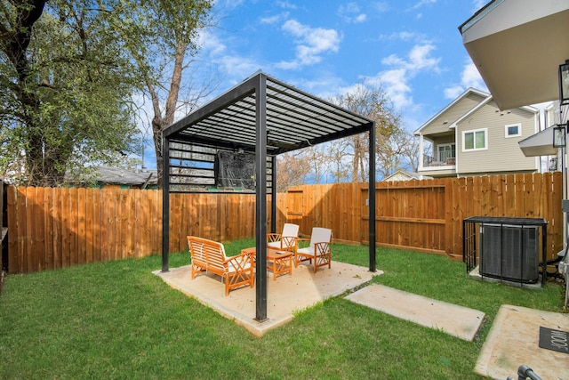 view of yard featuring central AC unit, a patio area, and a pergola