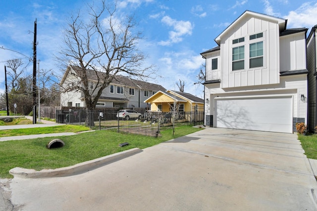 view of front of home featuring a garage and a front yard