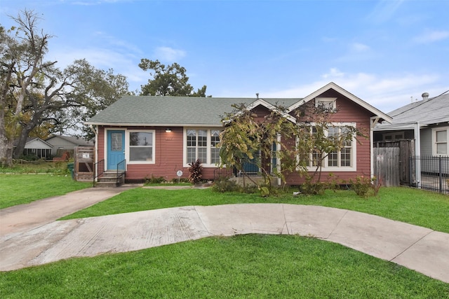 bungalow-style house with a front yard