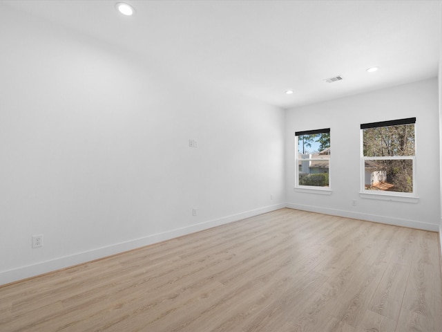 spare room with light wood-type flooring