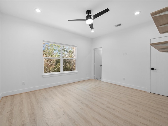 unfurnished room featuring ceiling fan and light hardwood / wood-style flooring