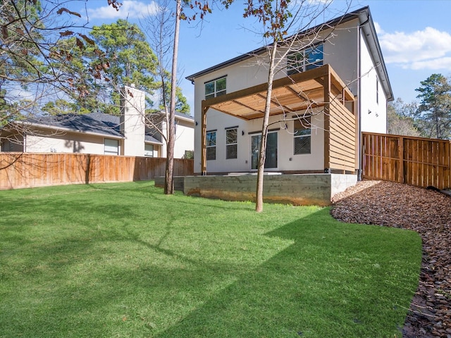 back of house with a lawn