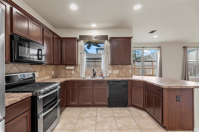 kitchen with sink, backsplash, black appliances, and kitchen peninsula