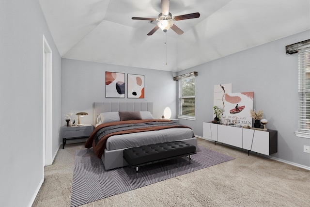 carpeted bedroom featuring lofted ceiling and ceiling fan