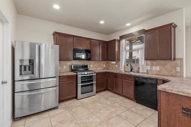 kitchen with sink, backsplash, black appliances, and light tile patterned floors