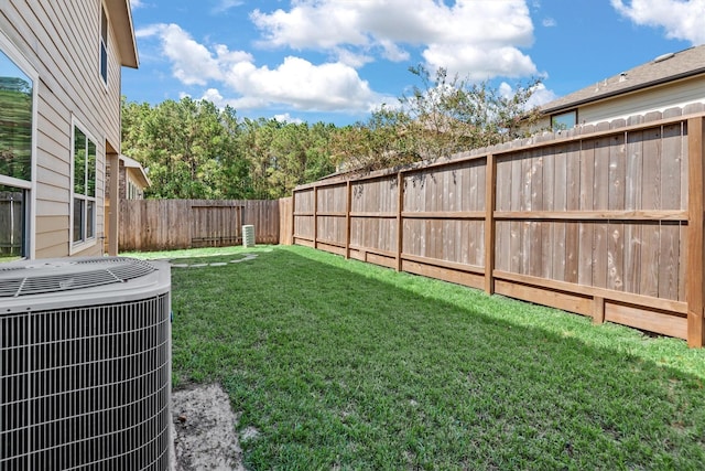 view of yard featuring central AC unit