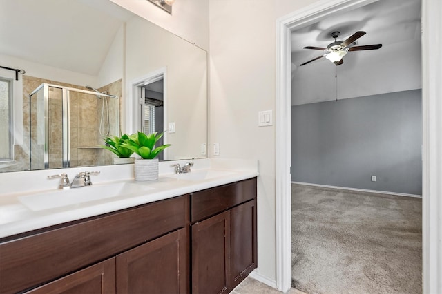 bathroom featuring ceiling fan, an enclosed shower, vanity, and vaulted ceiling