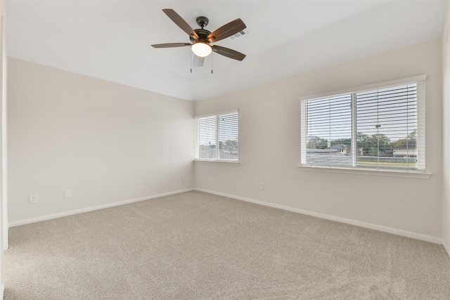 carpeted empty room with ceiling fan