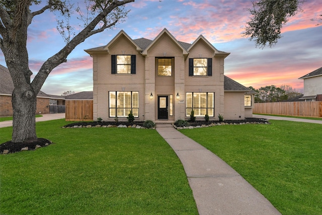 view of front of house with a lawn