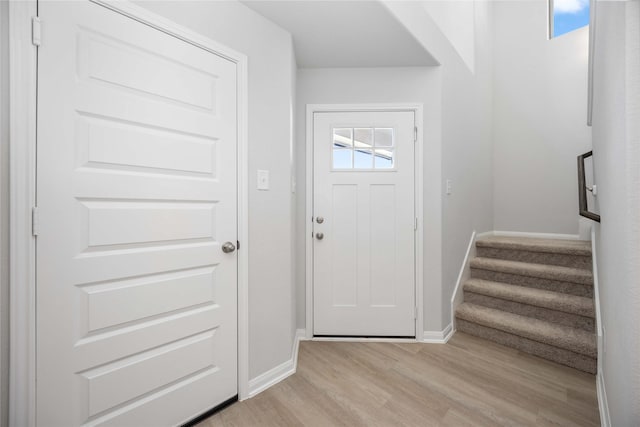 entrance foyer with light hardwood / wood-style flooring