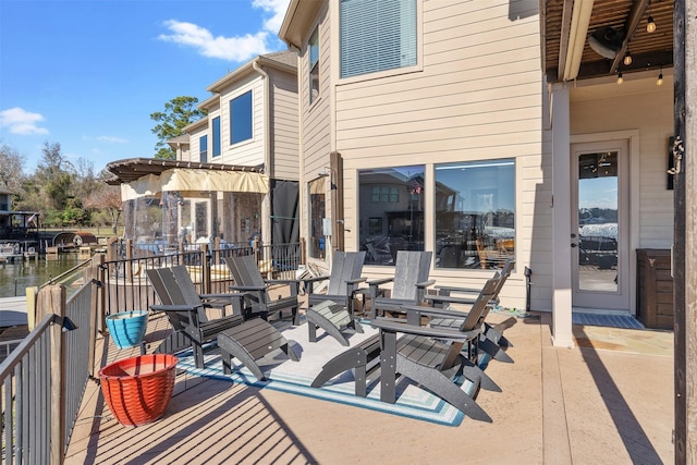 wooden deck with a water view