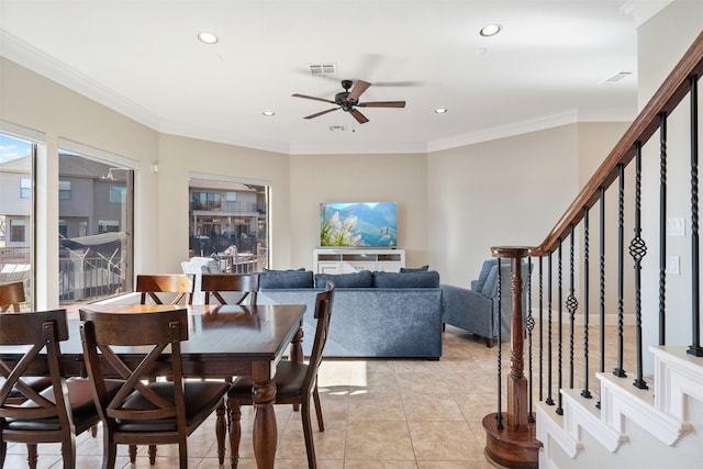 dining room featuring ceiling fan, crown molding, and light tile patterned flooring