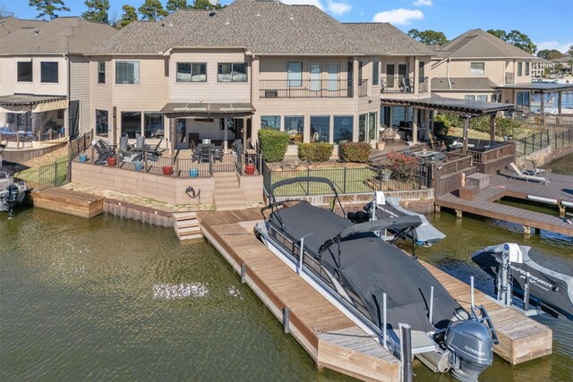 dock area with a water view and a patio area