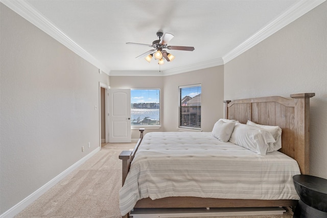 bedroom with ceiling fan, light colored carpet, and ornamental molding