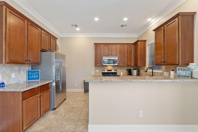 kitchen featuring appliances with stainless steel finishes, light tile patterned floors, kitchen peninsula, ornamental molding, and light stone counters