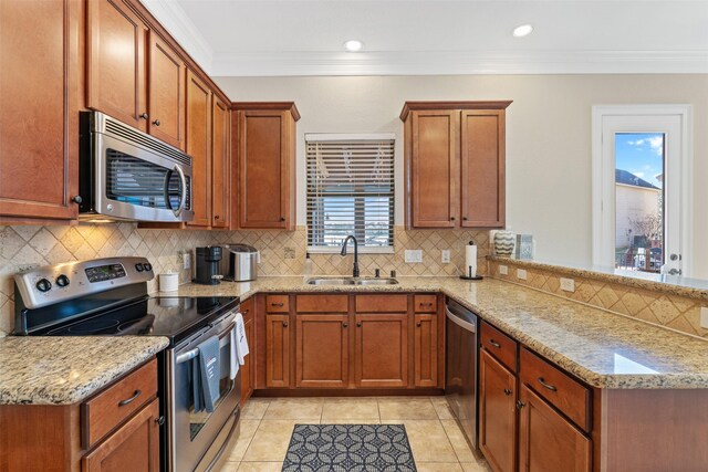 kitchen featuring sink, light stone counters, light tile patterned floors, and stainless steel appliances