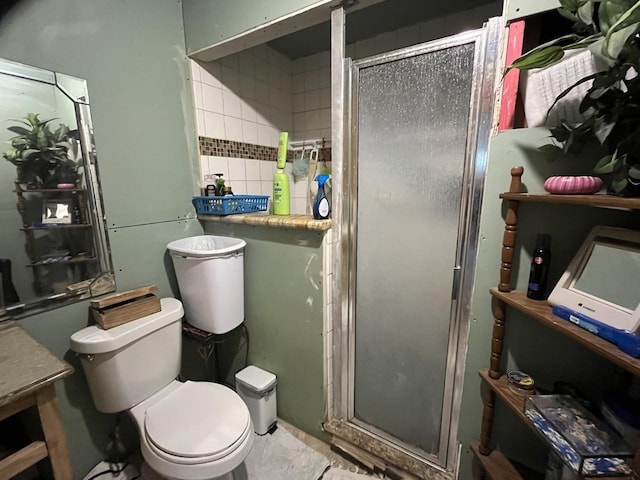 bathroom with toilet and walk in shower