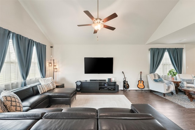 living room with wood-type flooring, ceiling fan, and lofted ceiling