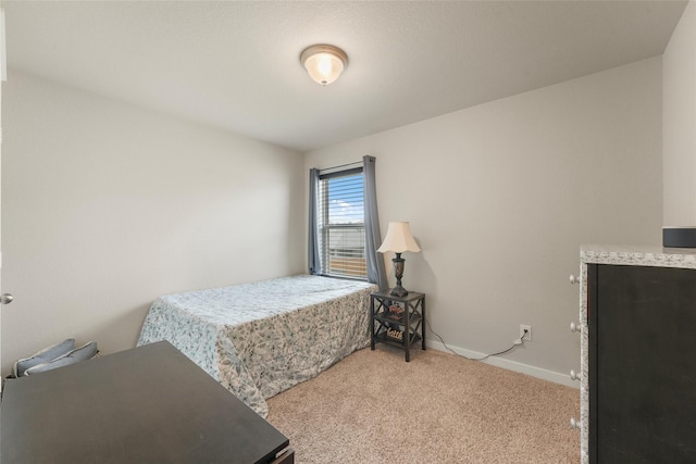 bedroom with light colored carpet