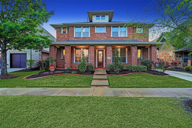 view of front of home with covered porch and a front lawn